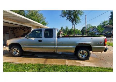 2001, 1500 Chevy Silverado, 4WD, silver, extended cab with a long bed (8 foot). 5.3L Vortec engine w
