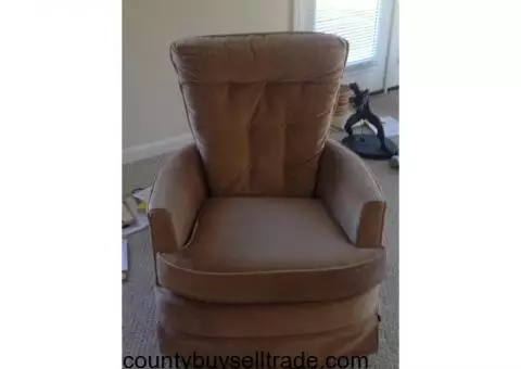 Swivel rocker armchair